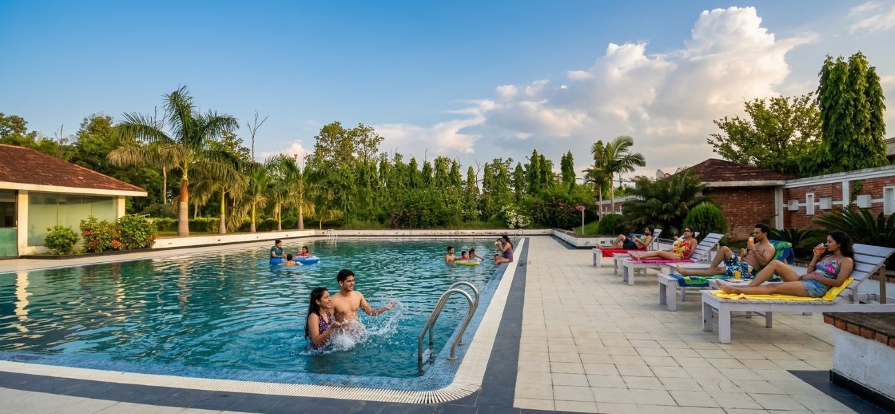 Swimming pool and gardens at Lumbini Hotel Kasai
